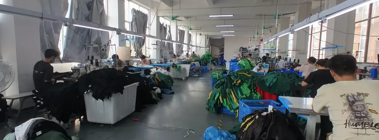 Sewing machine operators at work on the Jiashun factory floor in Humen, Dongguan