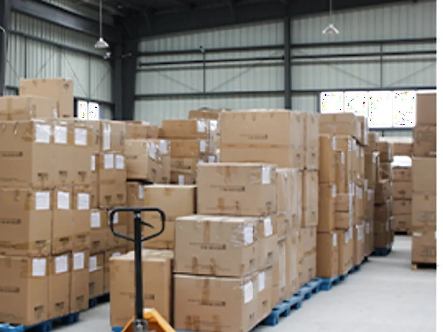 Packed cartons staged in the warehouse for shipment at the Humen factory