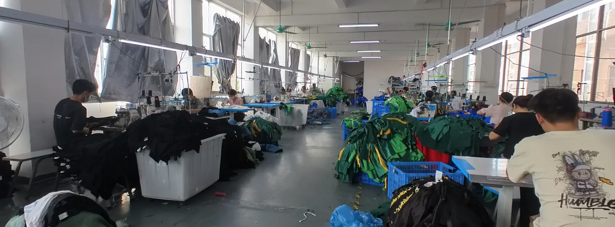 Sewing team working on garment production lines at the Humen factory